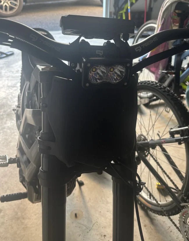 Baja headlight mounted on a rider's bike