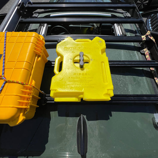 Billet aluminum Rotopax mount adapter for extrusion roof rack cross bars.