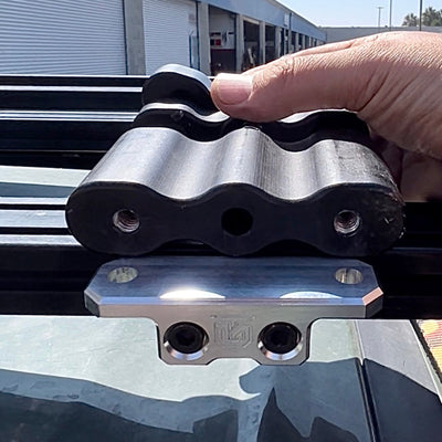 Billet aluminum Rotopax mount adapter for extrusion roof rack cross bars.